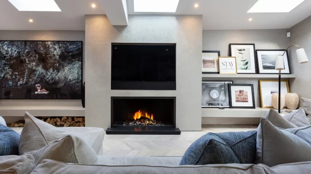 The 844LH bespoke gas fireplace has a steel heatlh and trim, along with a framed hole in the wall design