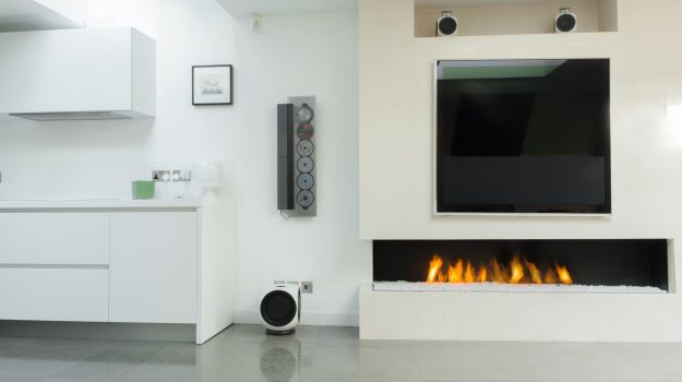 571 corner fireplace that has an integrated 1m burner which is a central feature within a modern kitchen space