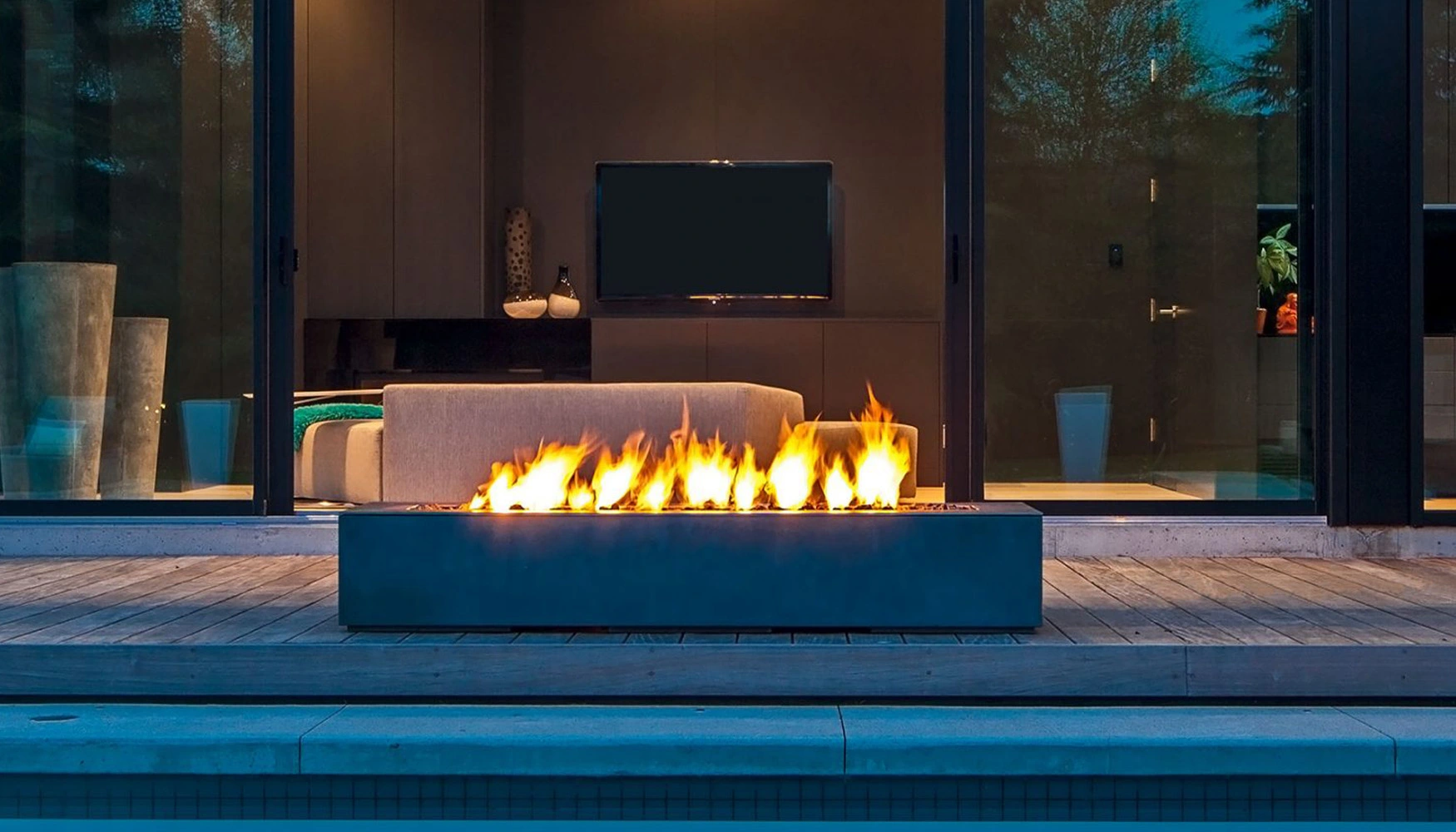 A custom built outdoor gas firepit with a ceremaic cladding for a durable design
