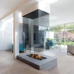 wide shot of 870 suspended glass fireplace near dining room