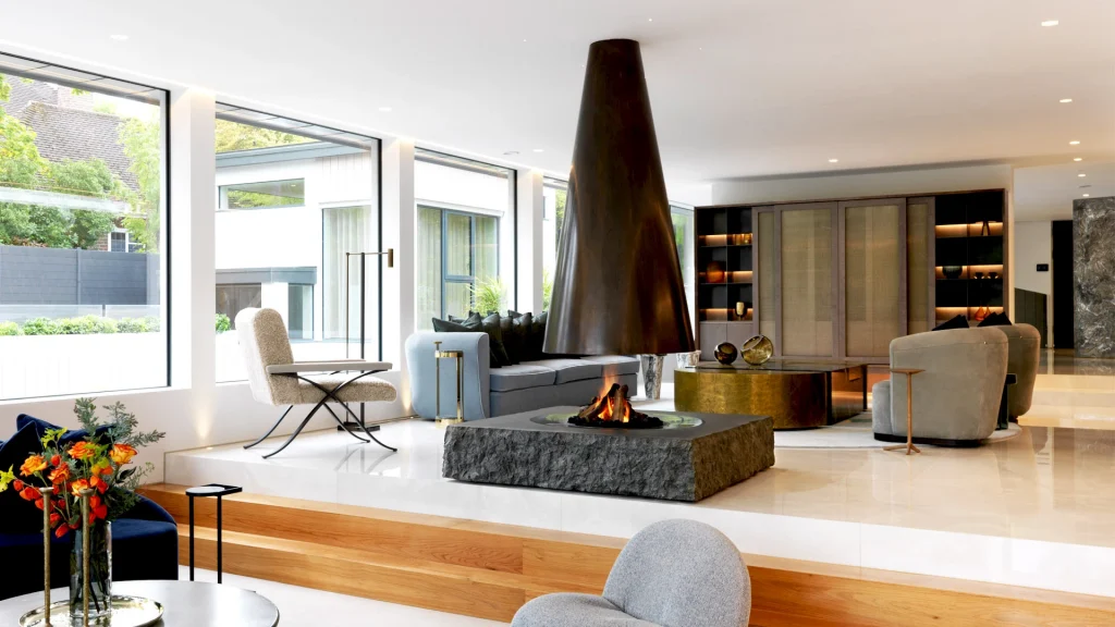 conical bronze suspended fireplace in living area