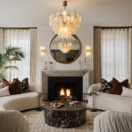 Bespoke open-front gas fireplace with marble mantel surround and fluted steel interior in a contemporary living space by Modus Fireplaces