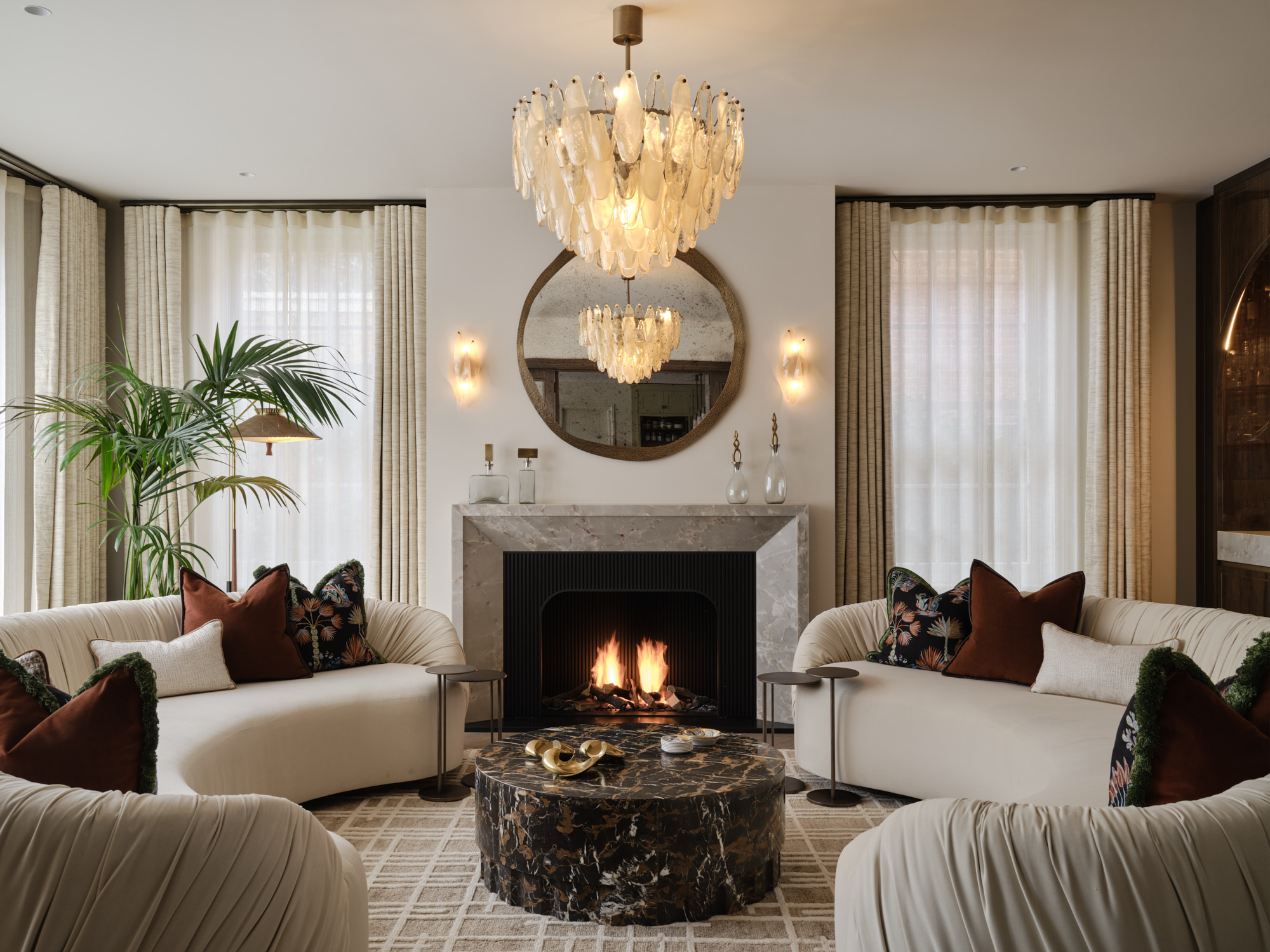 Bespoke open-front gas fireplace with marble mantel surround and fluted steel interior in a contemporary living space by Modus Fireplaces